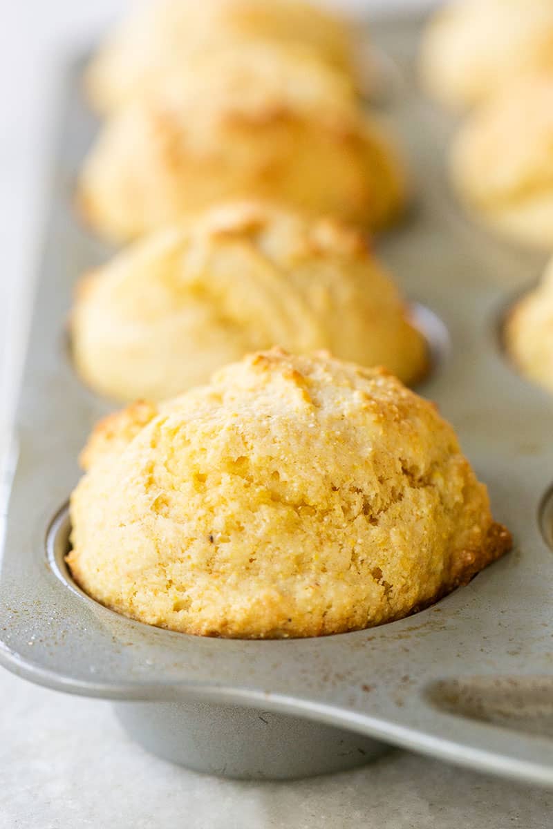 Homemade cornbread muffins in a muffin tin