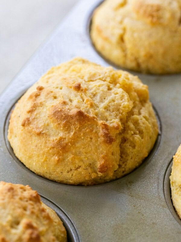 Cornbread muffins in a muffin tin.