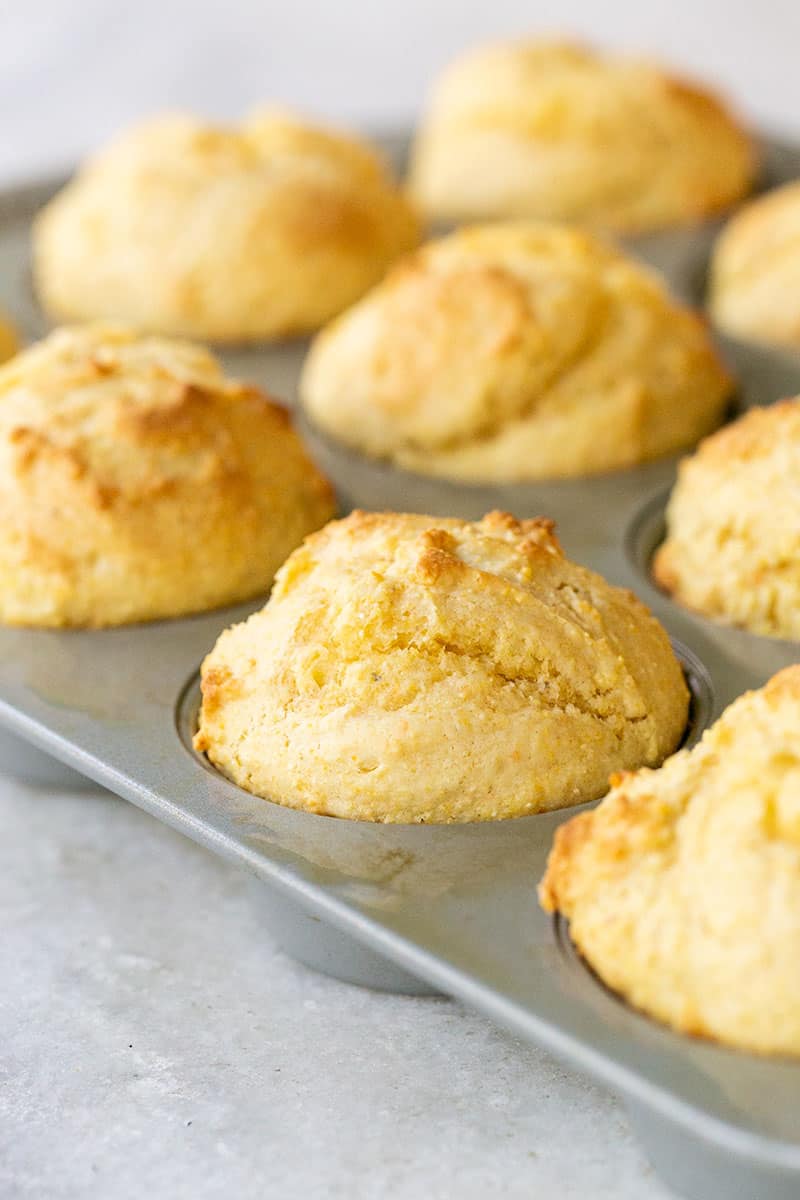 Cornbread muffins in a muffin tin.