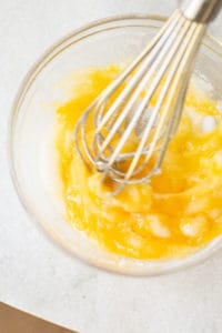 whisking eggs and butter