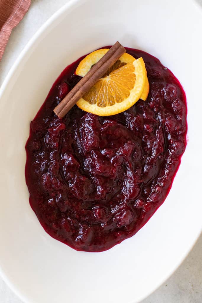 Cranberry sauce in a white bowl. 