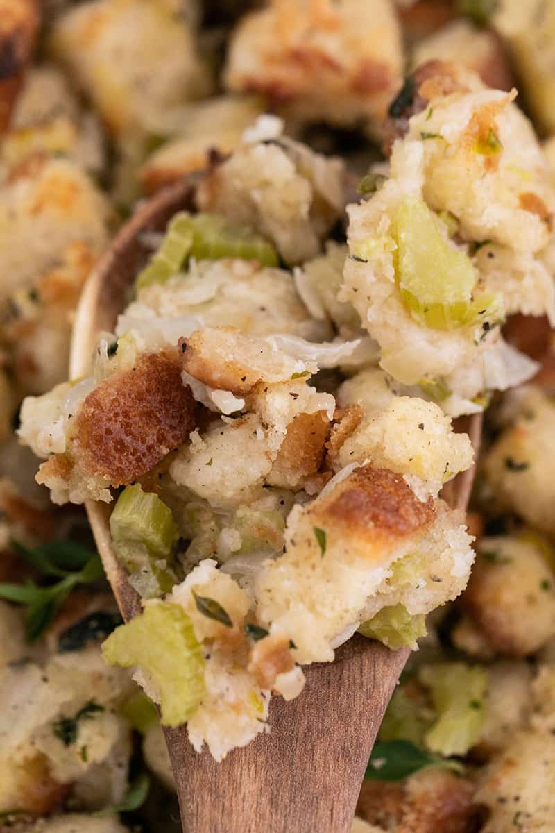 easy stuffing recipe on a wooden spoon.