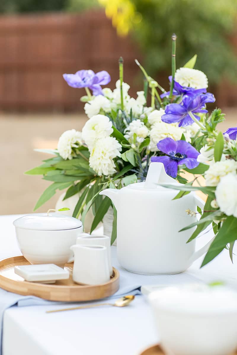 Tea set with a tea kettle and flowers 