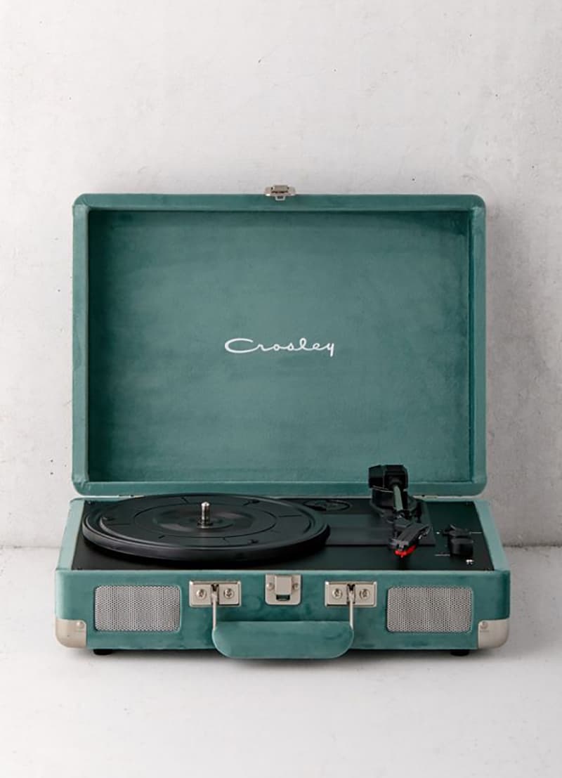 A green crossly record player for playing Christmas Music and playing Christmas songs. 