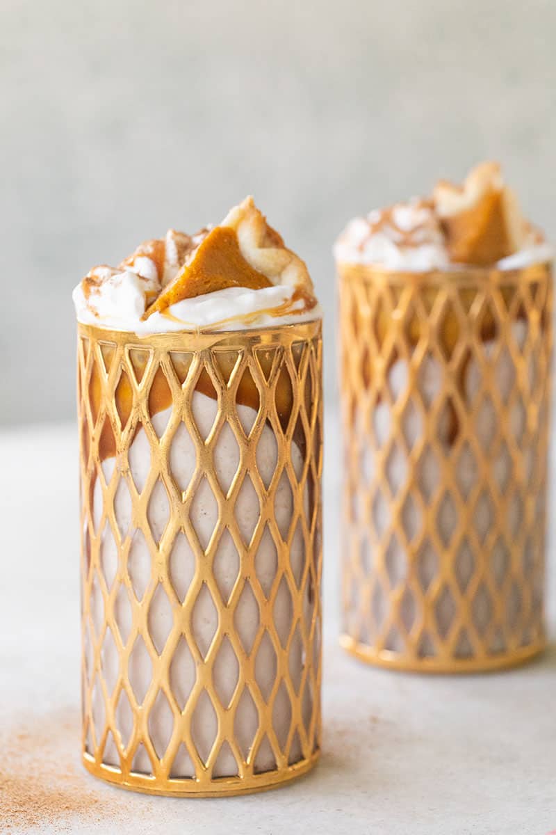 Two Pumpkin Pie Milkshakes with bourbon. Topped with whipped cream, caramel and a small slice of pumpkin pie. - pumpkin recipes