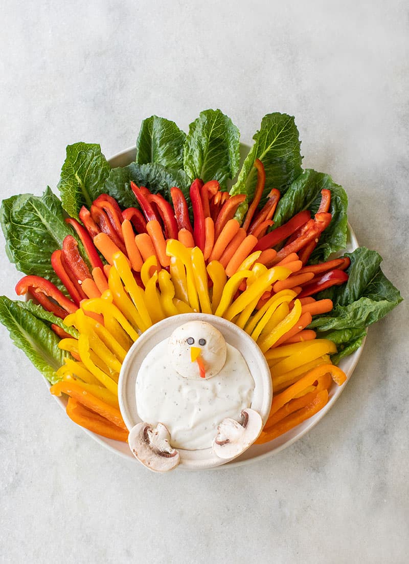A turkey vegetable platter with ranch dip.