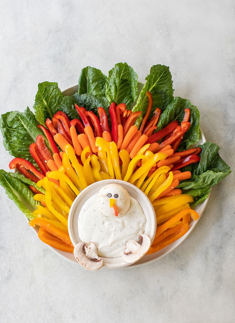 Kids vegetable platter for Thanksgiving shaped like a turkey.