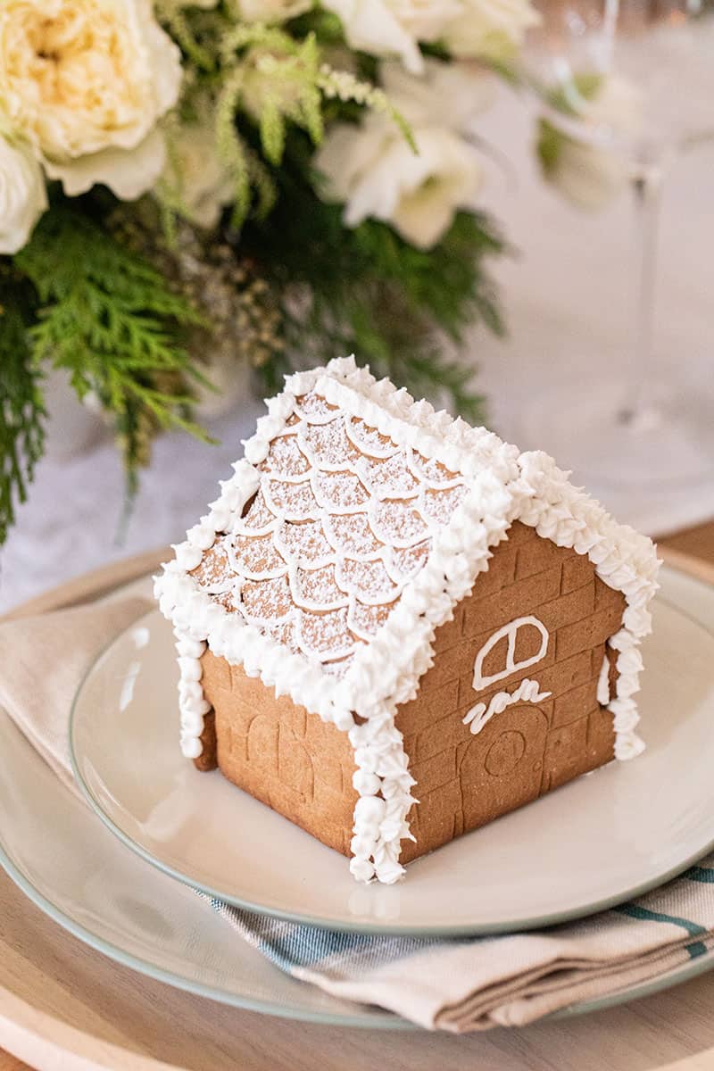 Small gingerbread house with Zan written on it in frosting. - christmas season