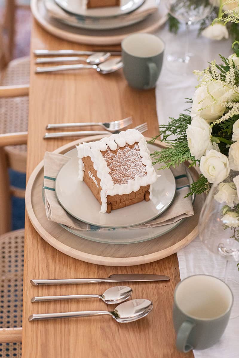 Small gingerbread house on a napkin and dinner plates from Bed Bath & Beyond. 