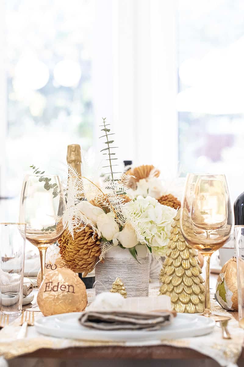 Christmas table setting with flowers, gold pears for Harry & David.