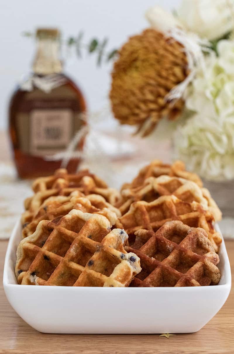 Waffles in a white bowl.