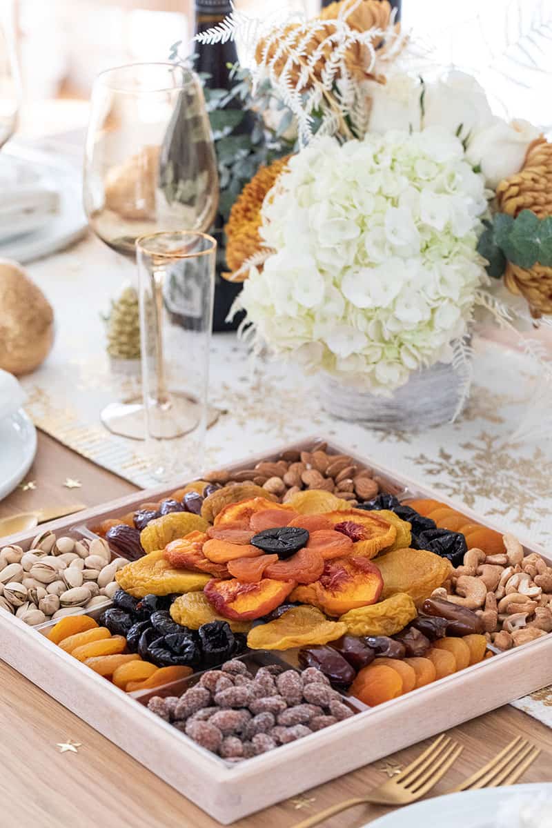 Dried fruit platter on a Christmas table setting.