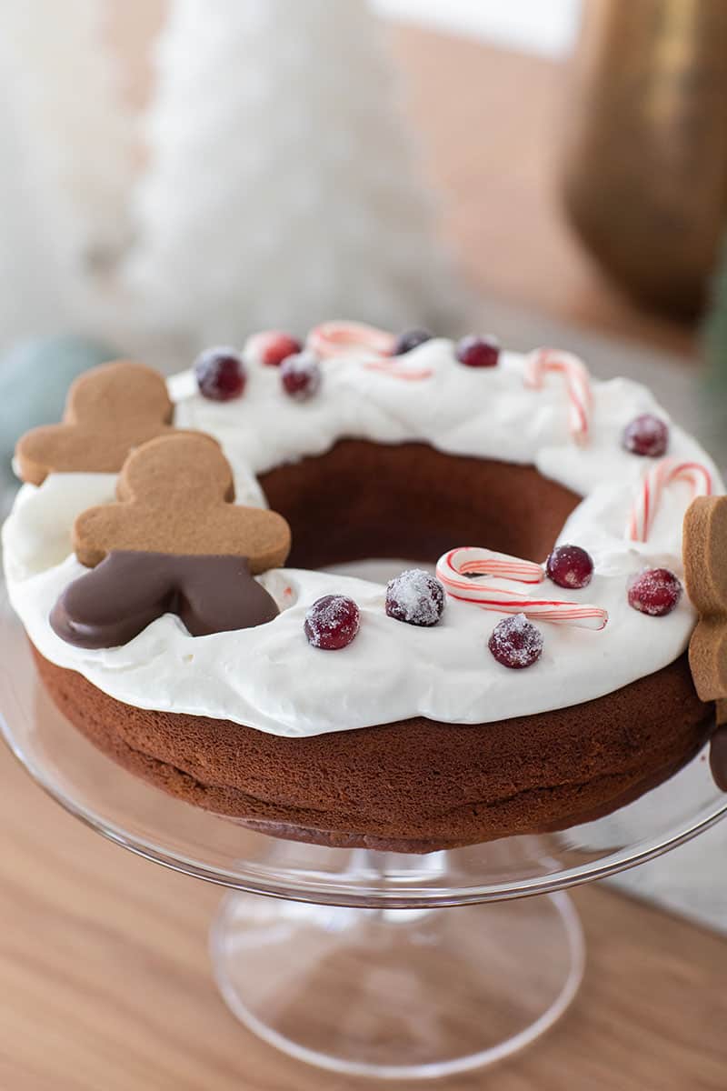 Gingerbread bunt cake with gingerbread men and berries and candy canes.