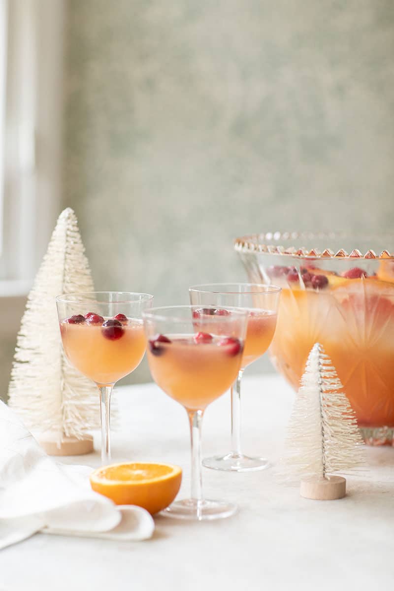 Coupes filled with citrus holiday punch recipe for a holiday party.