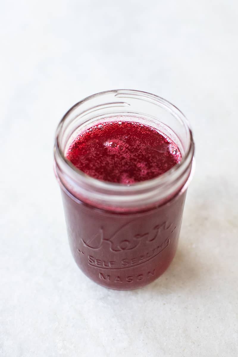 A jar of homemade cranberry simple syrup