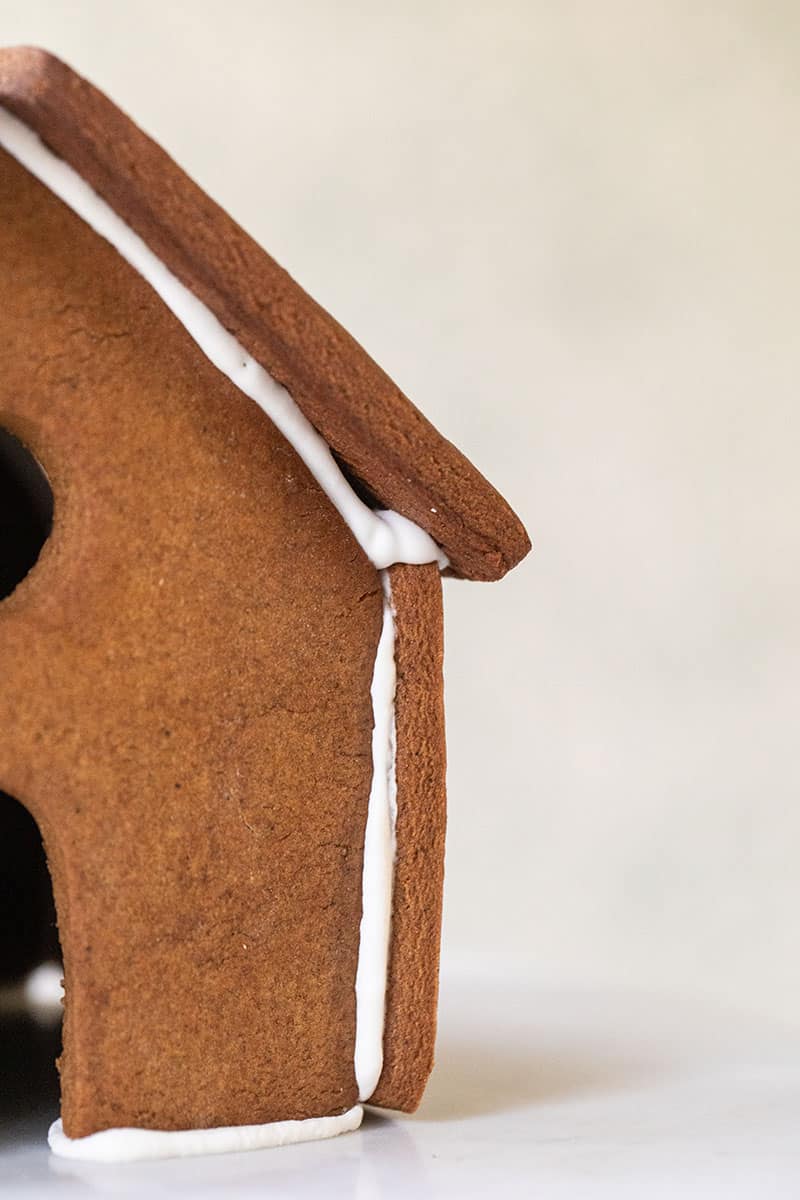 Building a gingerbread house with royal icing. 