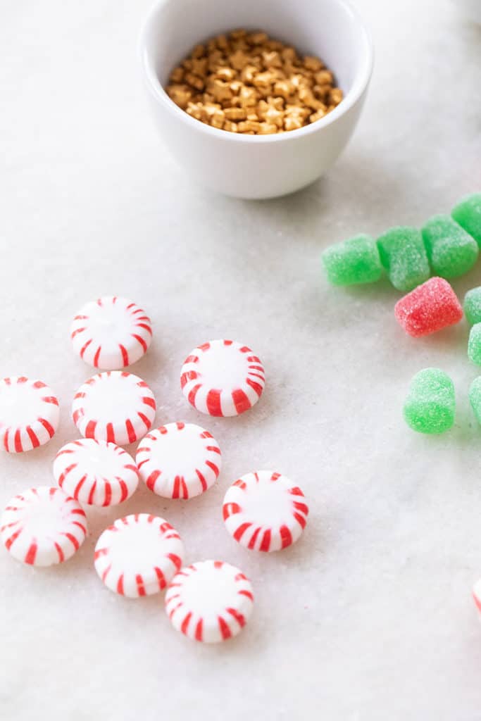 Peppermints and gum drops on a marble counter.