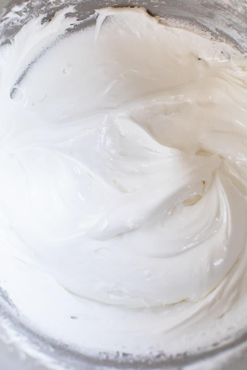 fluffy white gingerbread icing recipe in a metall bowl. 