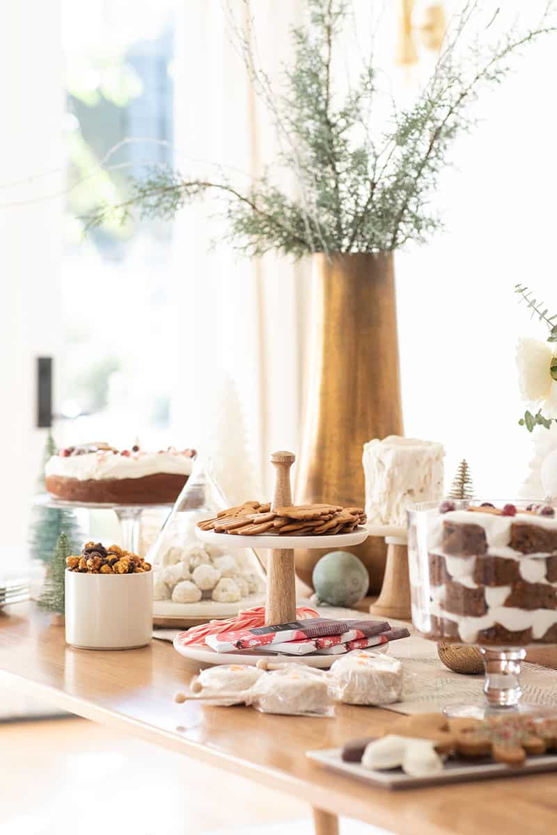 Christmas dessert table with cakes, cookies and candy.
