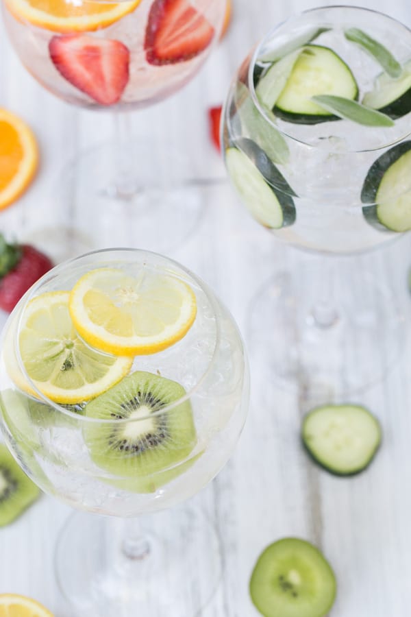 Classic, Spanish gin and tonics served in round glasses with sliced fruit. 