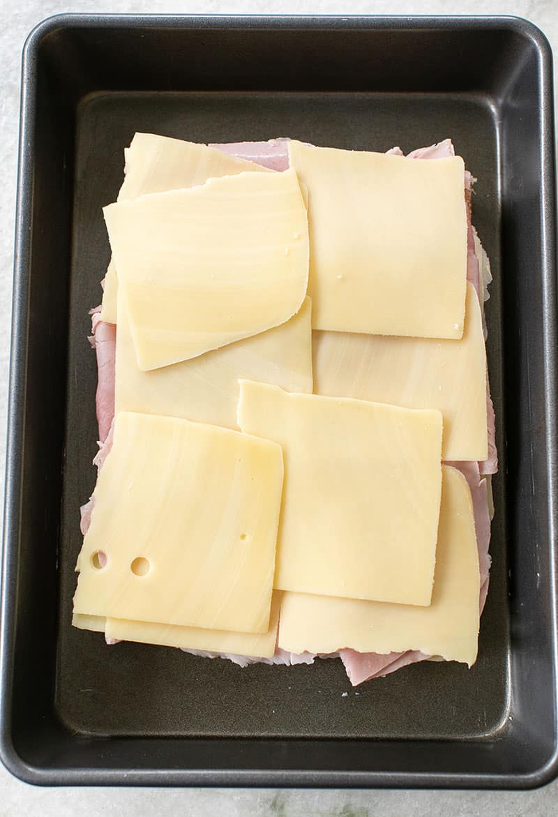 Swiss cheese on top of ham