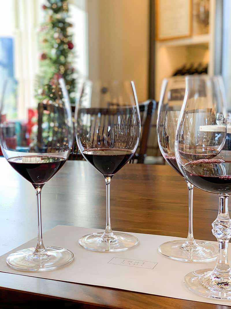 Four wine glasses filled with red wine at 1881 Napa 