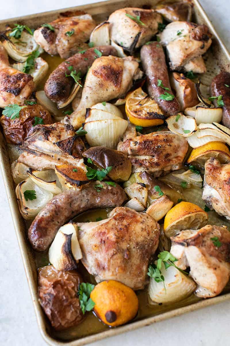 Chicken, sausage, apples, onions, lemons all baked on one sheet pan. 