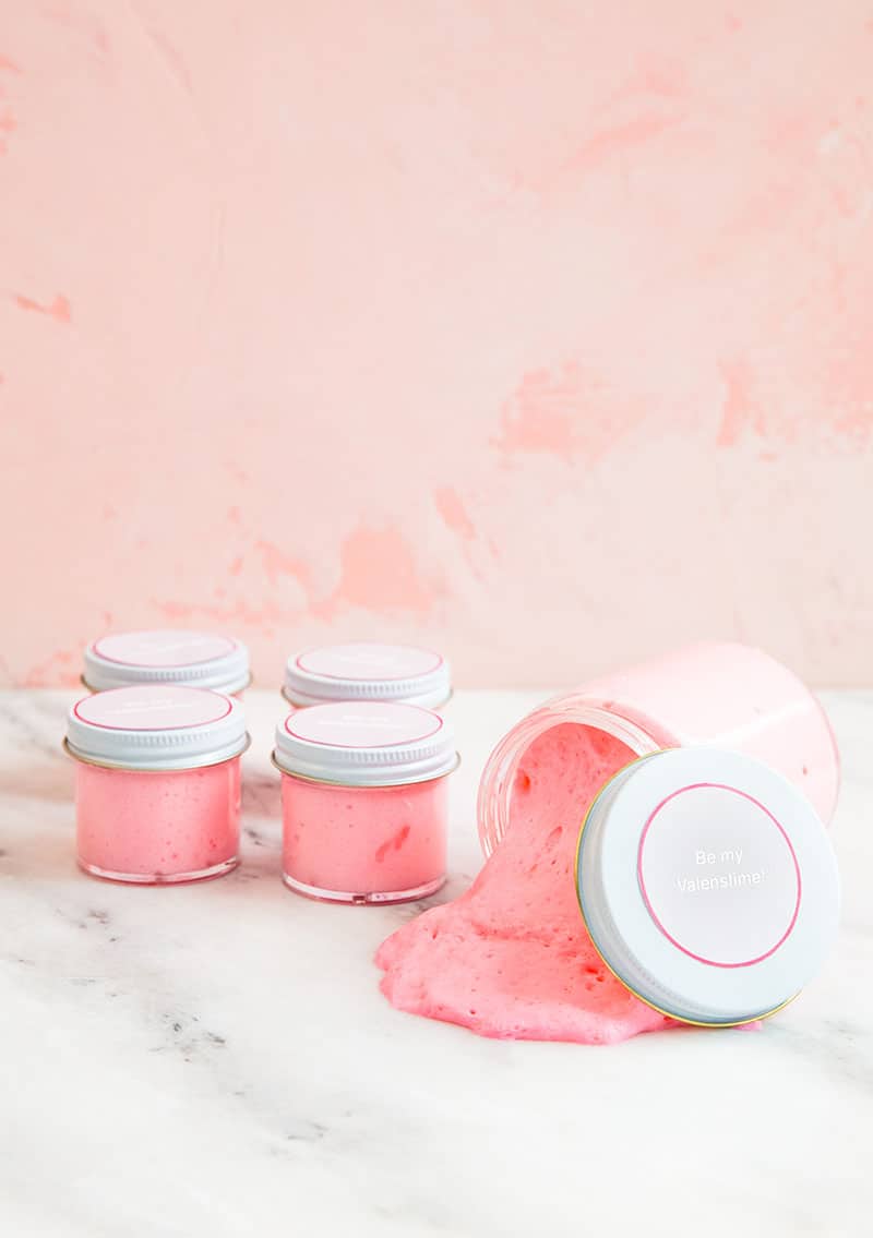 Pink slime in small glass jars with Valentine's Day printable