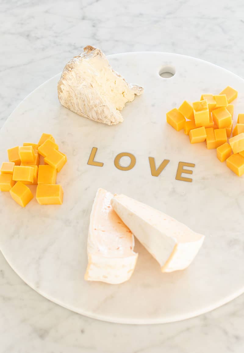 Cheese on a marble platter.