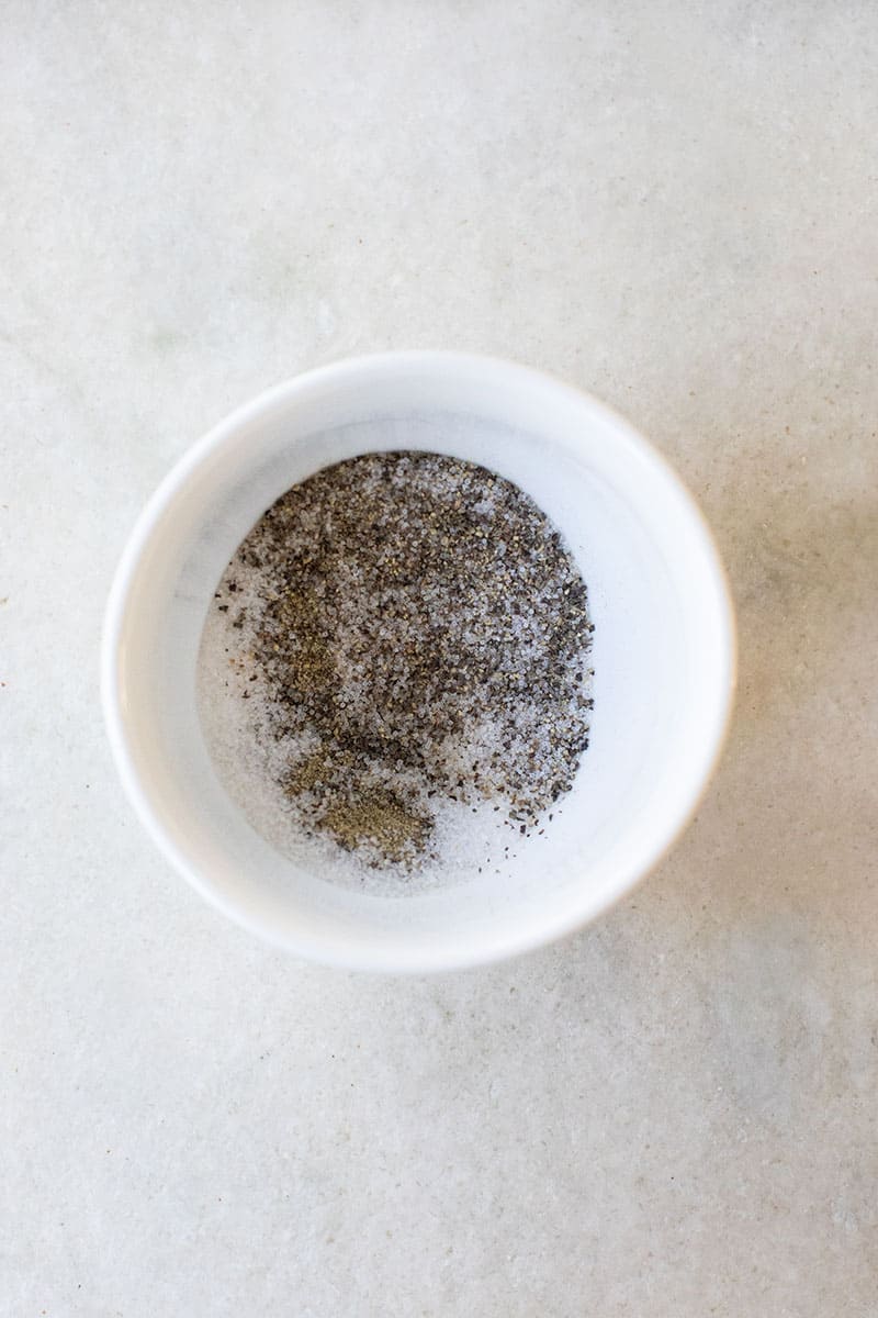 salt and pepper in a white bowl.