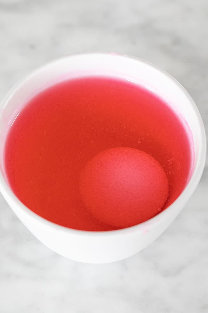 Egg in pink dye.