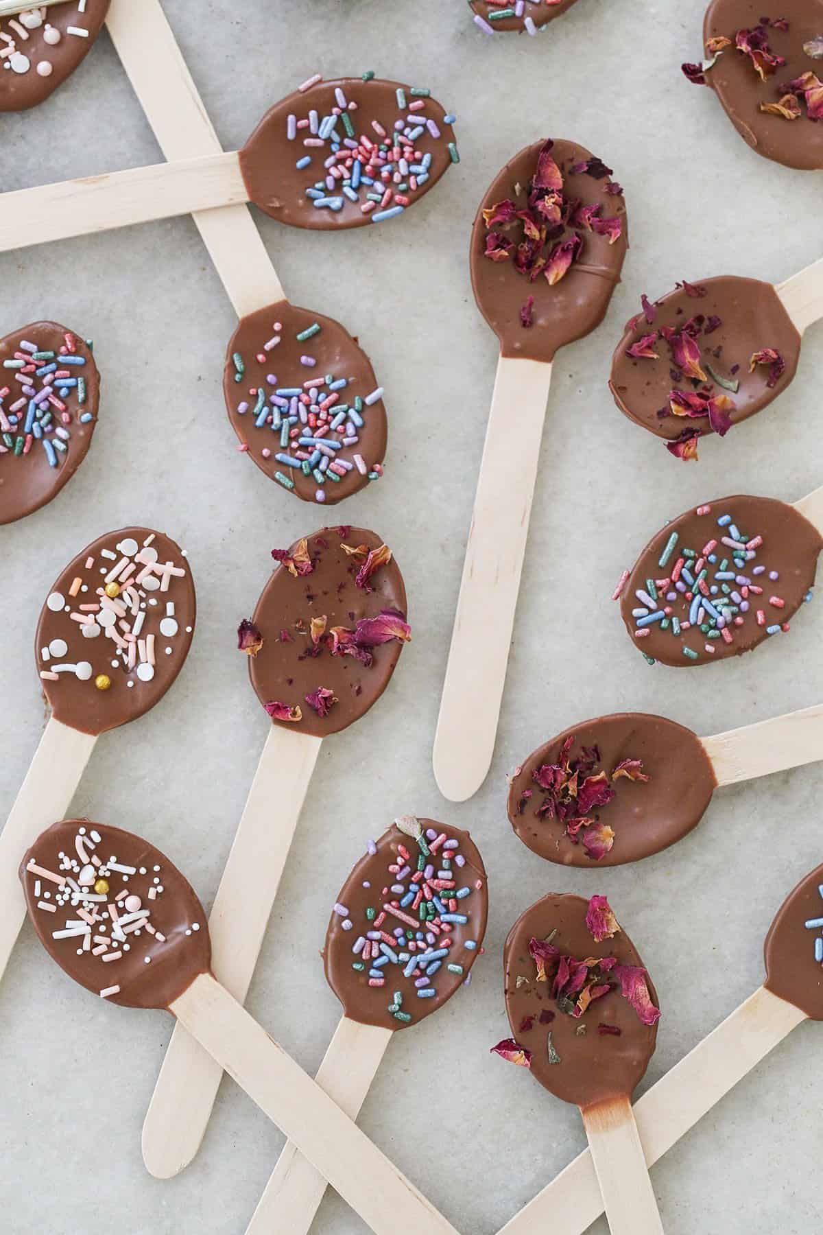 Chocolate-dipped spoons with sprinkles for ice cream.
