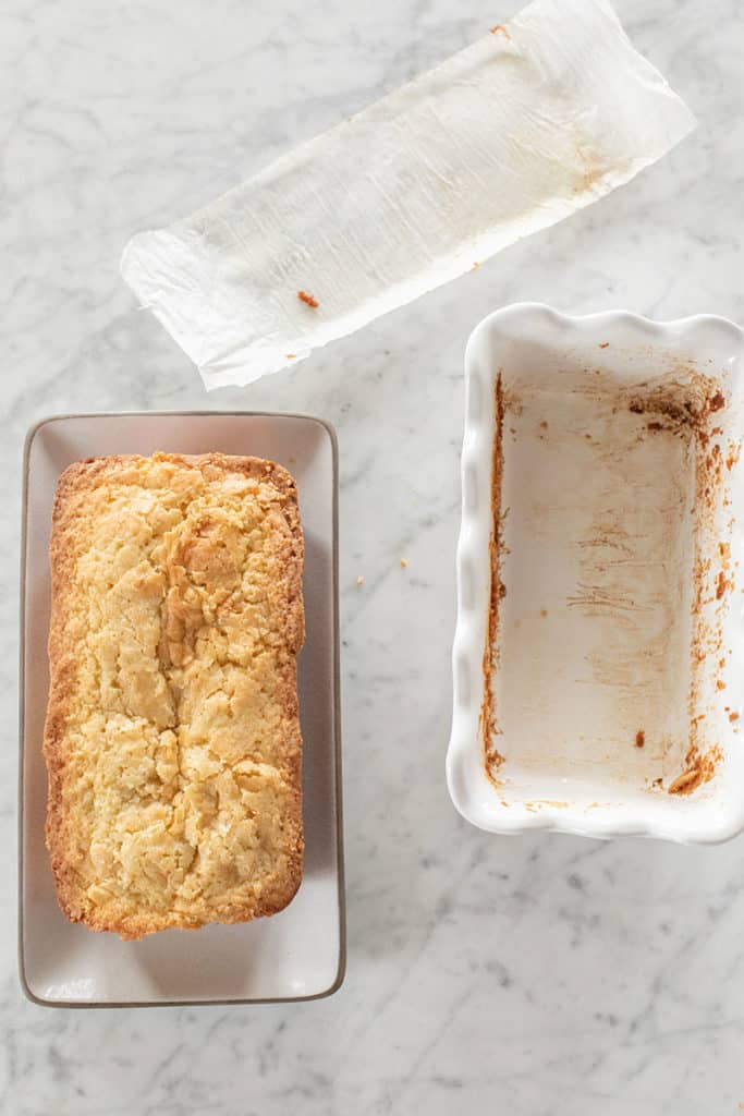 Coconut loaf cake before it has glaze drizzled over the top.