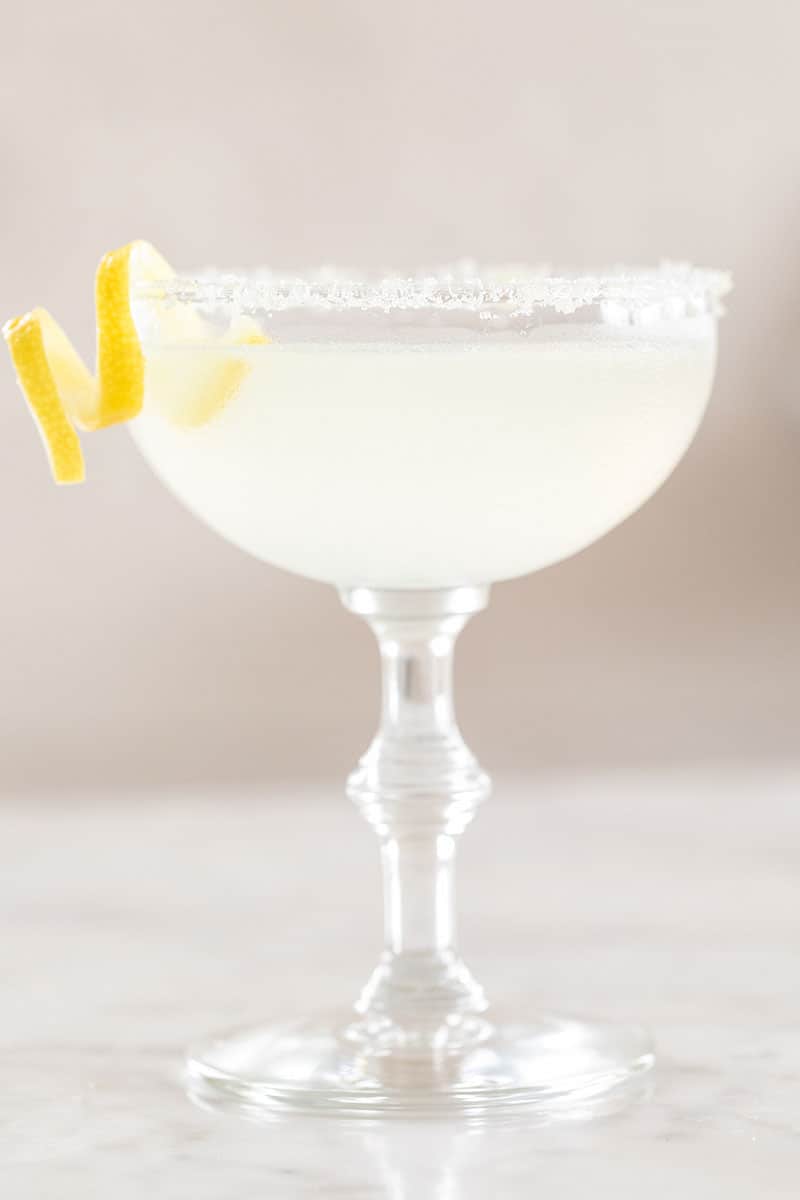 Lemon drop martini with a lemon twist and sugared rim.