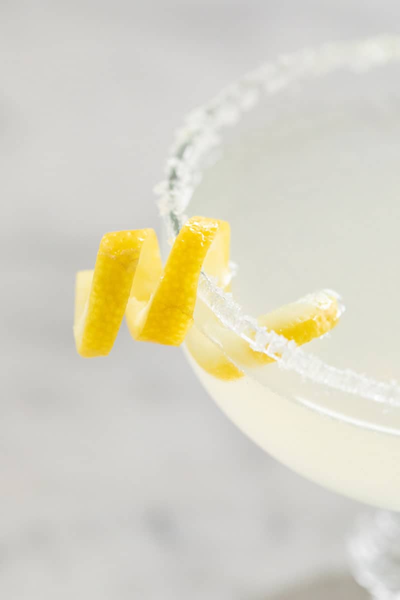 Lemon drop martini with a lemon twist and sugared rim.