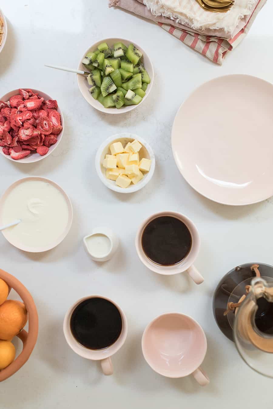 Fruit, butter and toppings to make a waffle bar.