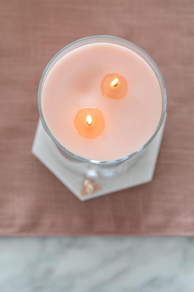 A pink lit candle 