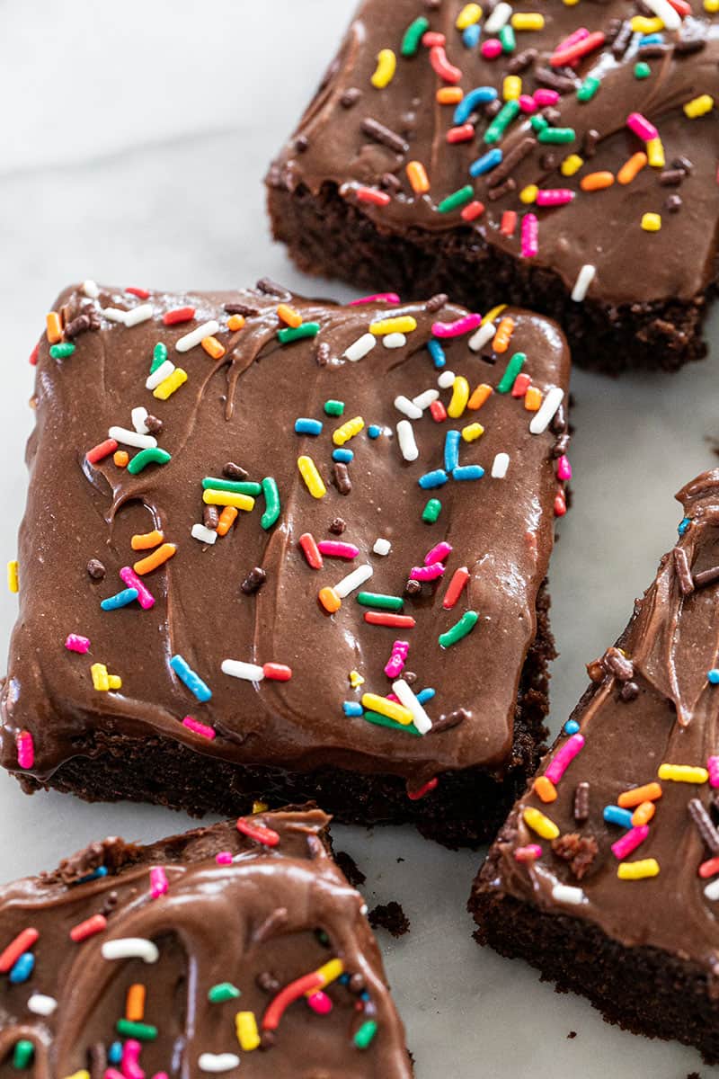 the best homemade brownies with sour cream frosting and sprinkles.