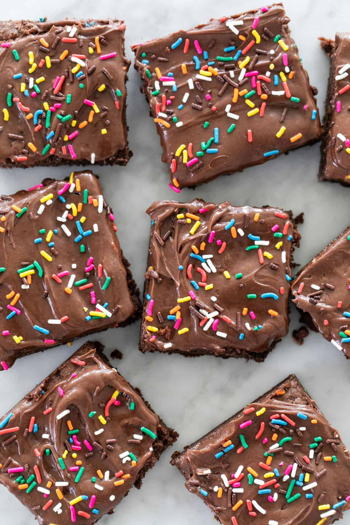 chocolate brownies with sprinkles over them.