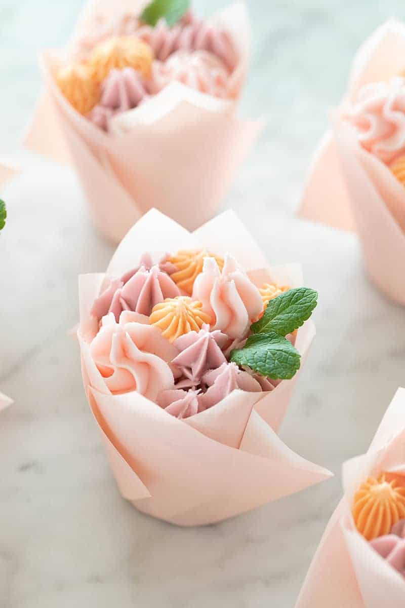 Cupcake bouquets wrapped in pink cupcake wrapper.