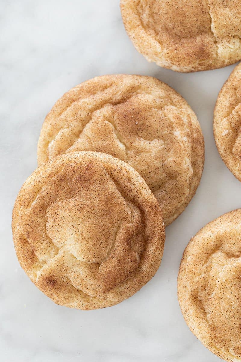 Snickerdoodles on a white countertop. 