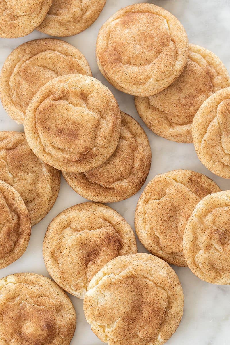 Chewy snickerdoodle cookies on a white background.