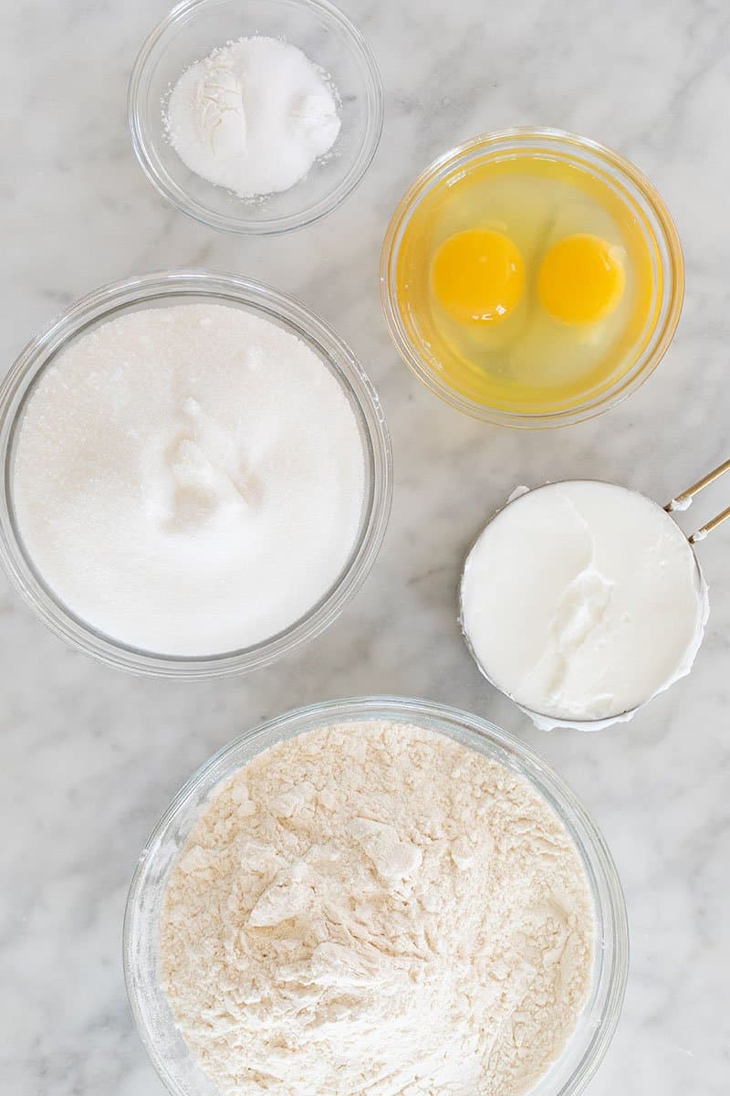 Ingredients needed for the best snickerdoodle recipe on a white countertop. 