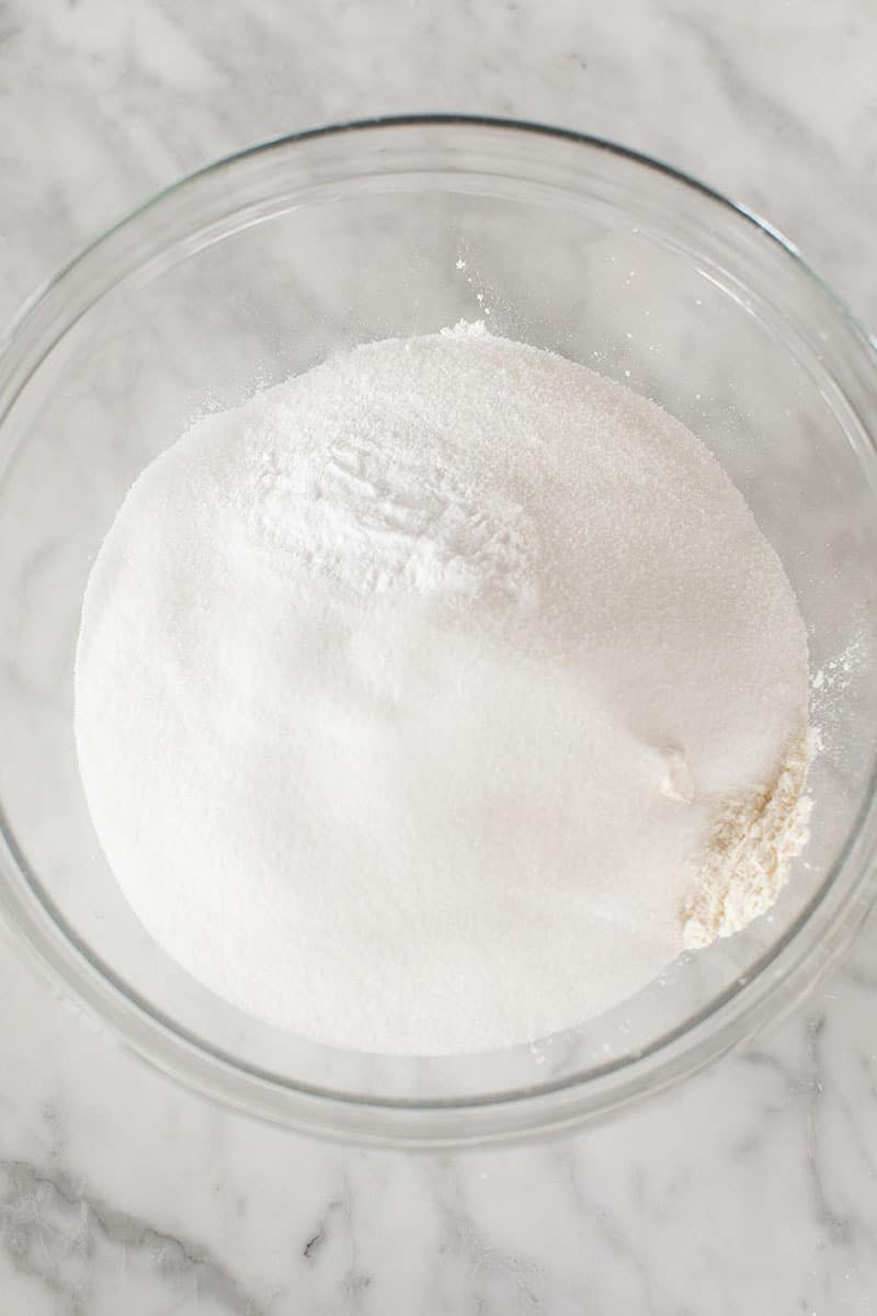 Flour, baking soda and sugar in a mixing bowl.