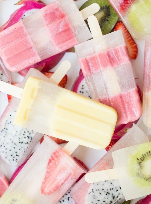 Coconut water popsicles with slices of fruit. 