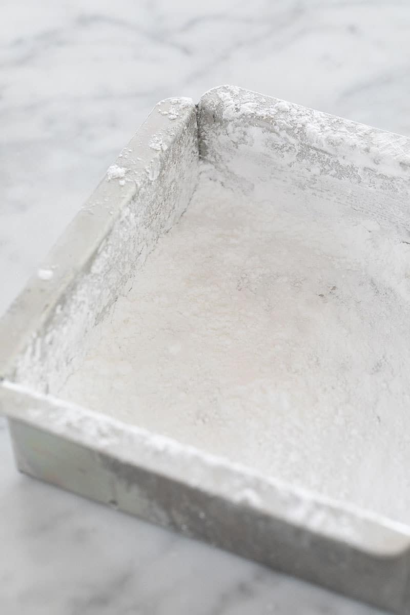 Baking dish with powdered sugar in it.