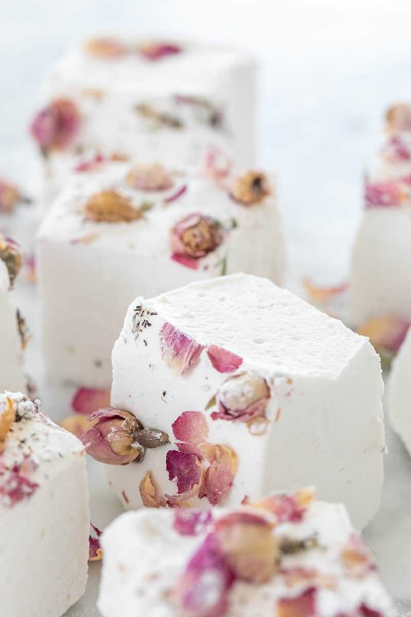 Homemade marshmallows with roses over the top.