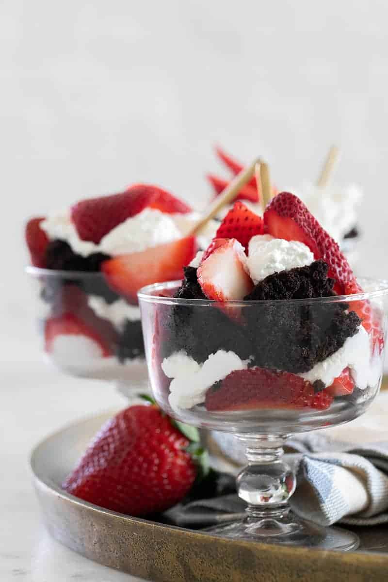 Strawberry trifle with chocolate cake layered with whipped cream. 