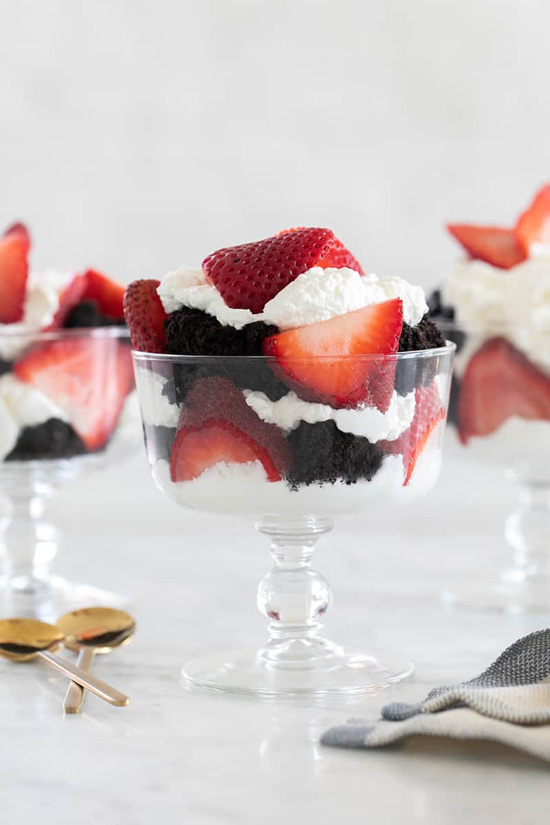 Chocolate strawberry trifle with whipped cream.