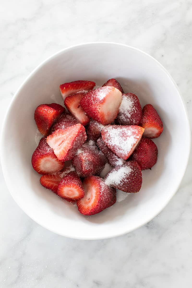 Strawberries with sugar in a bowl. 